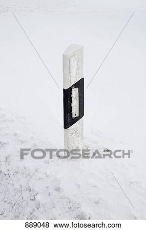 A roadside marker in a snowy setting View Large Photo Image Stock Photo - A roadside marker in a snowy setting. Fotosearch