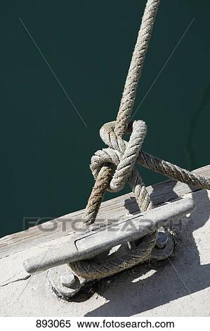A rope tied to jetty cleat View Large Photo Image Stock Photography - A rope tied to jetty cleat. Fotosearch