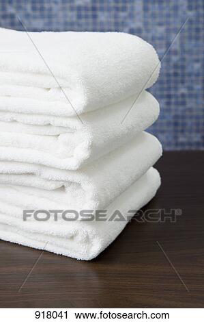 Stock Image - A stack of folded towels . Fotosearch