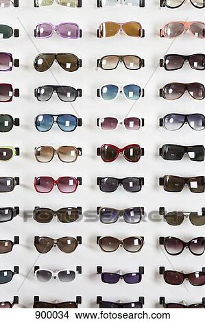Picture - A sunglasses display in an eyewear store. Fotosearch