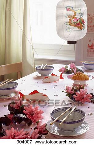 Stock Photo - A table with place settings and Japanese decorations. Fotosearch