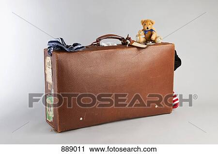 A teddy bear on top of an old suitcase View Large Photo Image Stock Image - A teddy bear on top of an old suitcase. Fotosearch