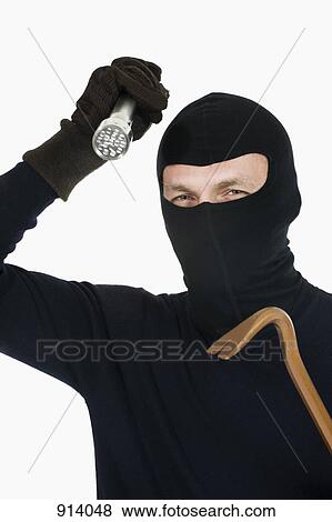 Stock Photo - A thief wearing a balaclava. Fotosearch