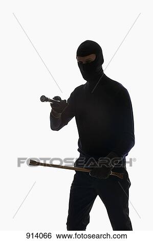 A thief wearing a balaclava View Large Photo Image Stock Photograph - A thief wearing a balaclava. Fotosearch