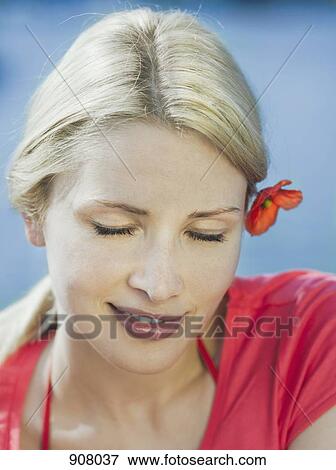 Stock Photo - A woman looking peaceful, portrait. Fotosearch