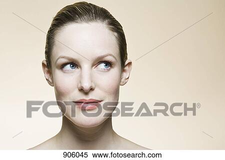 A woman looking up and to the side, close-up, human head View Large Photo Image Stock Photography - A woman looking up and to the side, close-up, human head. Fotosearch