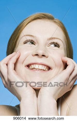 Picture - A woman smiling and laughing, portrait. Fotosearch