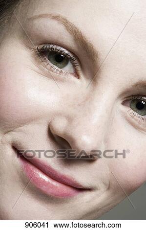 A woman smiling at the camera, extreme close up View Large Photo Image Stock Image - A woman smiling at the camera, extreme close up. Fotosearch