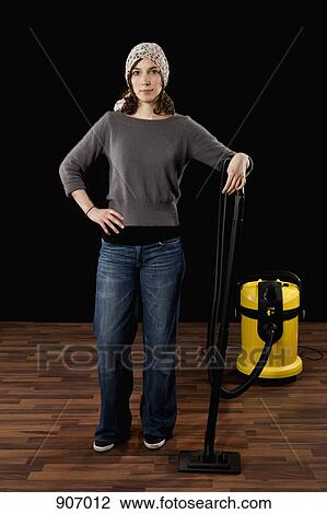 A Woman Standing Next To A Vacuum Cleaner View Large Photo Image Stock Image - A Woman Standing Next To A Vacuum Cleaner. Fotosearch
