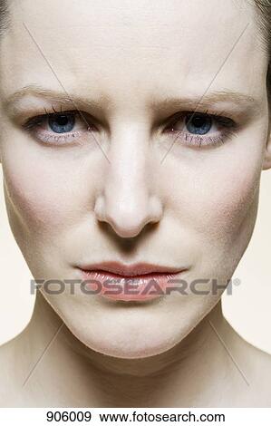 A woman with a furrowed brow, extreme close up View Large Photo Image Stock Photo - A woman with a furrowed brow, extreme close up. Fotosearch