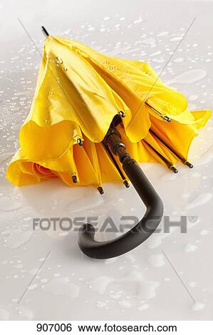 Stock Photograph - A Yellow Umbrella. Fotosearch