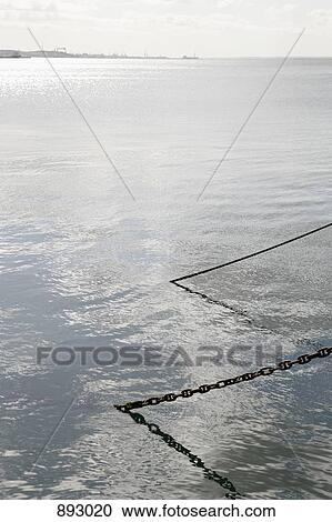 Anchor chains going into the sea View Large Photo Image Stock Image - Anchor chains going into the sea. Fotosearch
