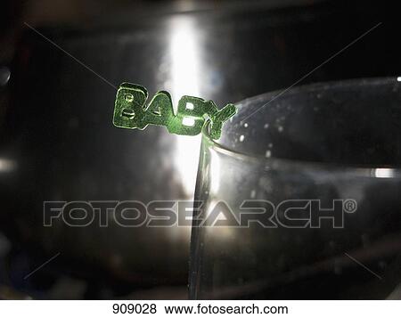 BABY decoration on the rim of a glass View Large Photo Image Stock Photo - BABY decoration on the rim of a glass. Fotosearch