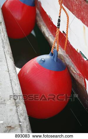 Boat bumpers tied to a boat docked at a jetty View Large Photo Image Stock Image - Boat bumpers tied to a boat docked at a jetty. Fotosearch