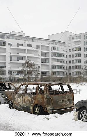 Burned out cars on a snow covered street View Large Photo Image Stock Photo - Burned out cars on a snow covered street. Fotosearch