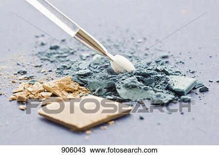 Crushed blue and beige eye shadow and a make-up brush View Large Photo Image Stock Image - Crushed blue and beige eye shadow and a make-up brush. Fotosearch