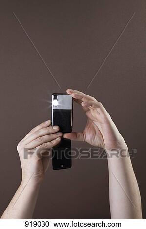 Detail of a man taking a photograph View Large Photo Image Stock Image - Detail of a man taking a photograph. Fotosearch