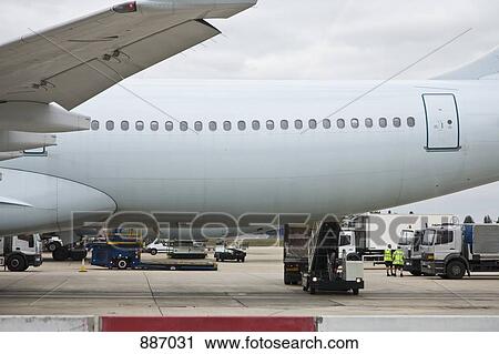Stock Image - Detail of a plane at an airport. Fotosearch