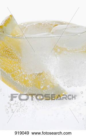 Stock Photo - Detail of a slice of lemon in water. Fotosearch