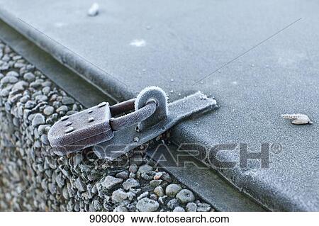 Stock Photo - Detail of frost on a locked container. Fotosearch