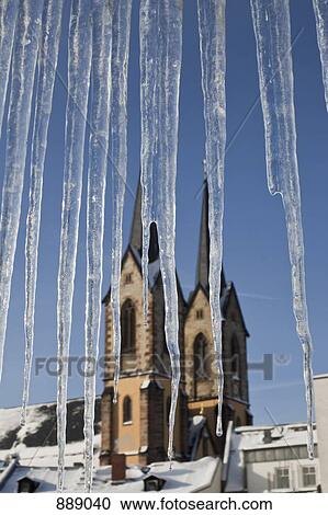 Detail of icicles and a church in the background View Large Photo Image Stock Image - Detail of icicles and a church in the background. Fotosearch