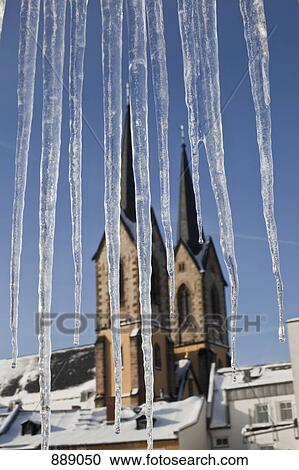 Detail of icicles and a church in the background View Large Photo Image Stock Image - Detail of icicles and a church in the background. Fotosearch