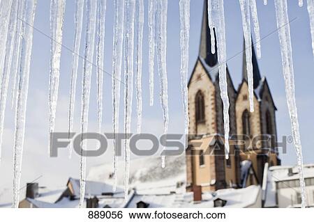 Detail of icicles and a church in the background View Large Photo Image Stock Photograph - Detail of icicles and a church in the background. Fotosearch
