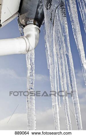 Detail of icicles hanging from a roof View Large Photo Image Picture - Detail of icicles hanging from a roof. Fotosearch