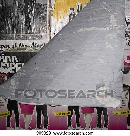 Stock Photo - Detail of peeling posters on a wall. Fotosearch