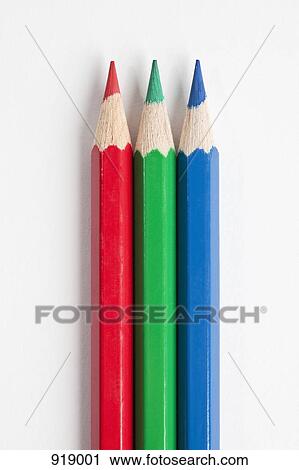 Stock Image - Detail of three pencils in RGB colors. Fotosearch
