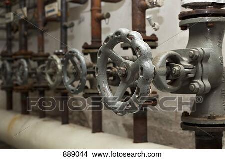 Picture - Detail of valves and pipes. Fotosearch