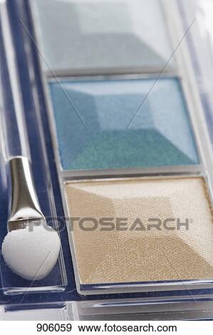 Stock Photo - Eye shadow compact with make-up brush. Fotosearch