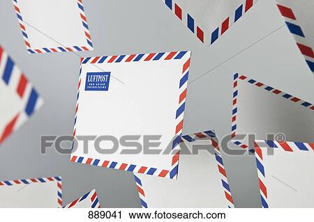 Stock Image - Floating air mail envelopes. Fotosearch