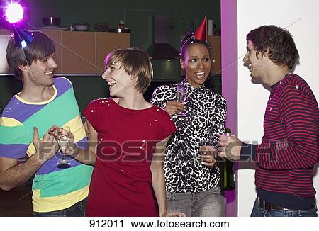 Four friends celebrating with confetti and champagne View Large Photo Image Stock Image - Four friends celebrating with confetti and champagne. Fotosearch