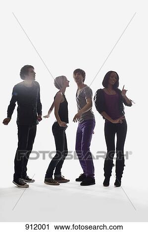 Four young people dancing, studio shot, white background, back lit View Large Photo Image Stock Image - Four young people dancing, studio shot, white background, back lit. Fotosearch