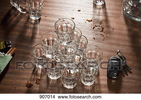 Glasses Stacked On Top Of Each Other On A Messy Table View Large Photo Image Picture - Glasses Stacked On Top Of Each Other On A Messy Table. Fotosearch