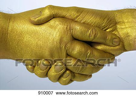 Golden handshake View Large Photo Image Stock Photo - Golden handshake. Fotosearch