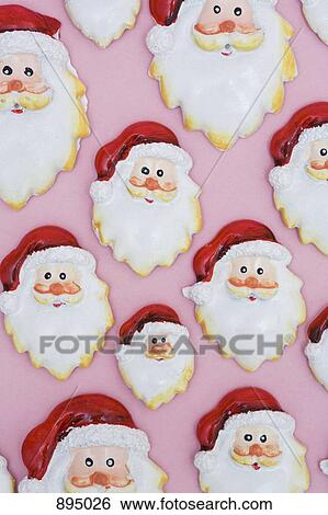 Stock Photograph - Group of Santa head decorations in various sizes. Fotosearch
