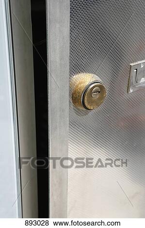 Lock on a door, close-up View Large Photo Image Stock Photo - Lock on a door, close-up. Fotosearch