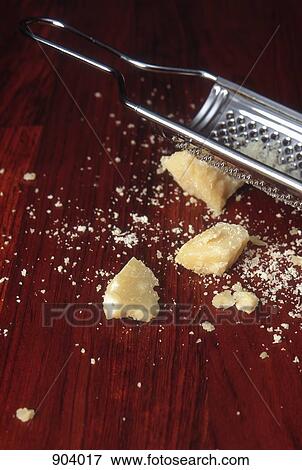 Stock Photo - Parmesan cheese and grater. Fotosearch