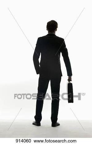 Stock Image - Portrait of a businessman, rear view. Fotosearch