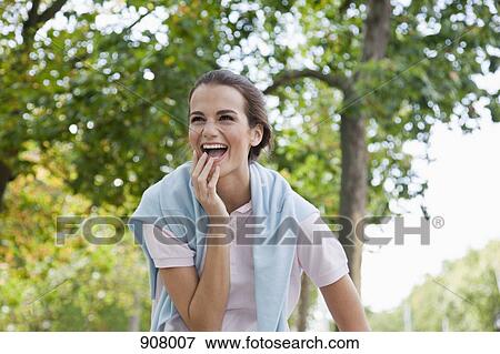 Stock Photo - Portrait of a woman laughing. Fotosearch