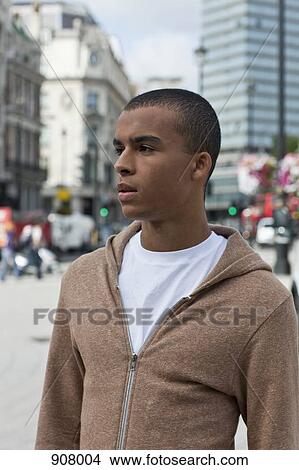 Picture - Portrait of a young man in city. Fotosearch