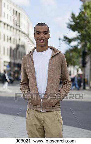 Stock Image - Portrait of a young man in the city. Fotosearch