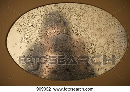 Reflection in an old mirror of a person taking a photograph View Large Photo Image Stock Image - Reflection in an old mirror of a person taking a photograph. Fotosearch