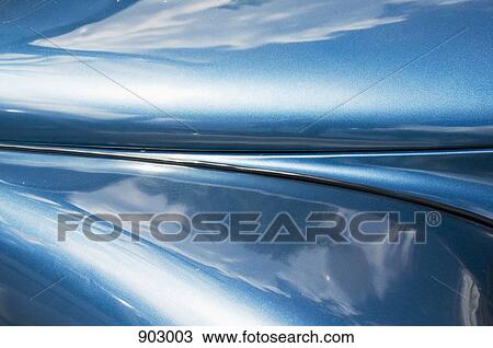Stock Image - Reflection in the side of a vehicle. Fotosearch