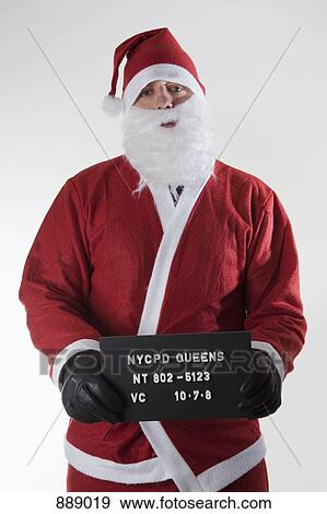 Stock Photo - Santa Claus posing for a mug shot. Fotosearch