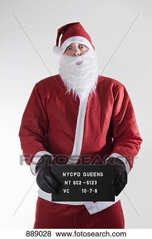 Santa Claus posing for a mug shot View Large Photo Image Stock Photo - Santa Claus posing for a mug shot. Fotosearch