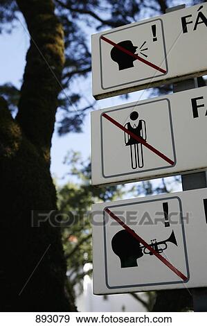 Stock Photo - Signs for No Shouting, No Women and No Music. Fotosearch