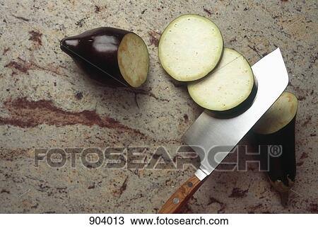 Sliced eggplant and cleaver View Large Photo Image Stock Image - Sliced eggplant and cleaver. Fotosearch